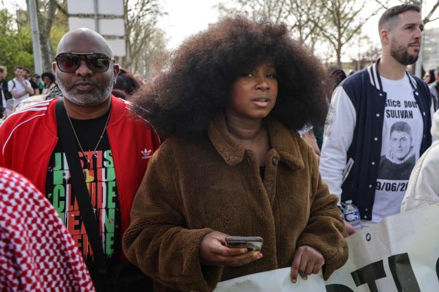 French activist and leader of the Truth and Justice for Adama Committee Assa Traore attends a march in support of late French teenager Nahel and against Police impunity following the court's reclassification of the charges, in Nanterre, suburb of Paris on March 21, 2026. The Versailles Court of Appeal on March 5, 2026 has ordered a trial for assault resulting in death without intent against the Police officer who killed Nahel Merzouk, who was initially charged with murder. Nahel Merzouk, aged 17, was killed on June 27, 2023 by a bullet fired at point-blank range by a Police officer who was stopping the vehicle he was driving. (Photo by Ludovic MARIN / AFP)