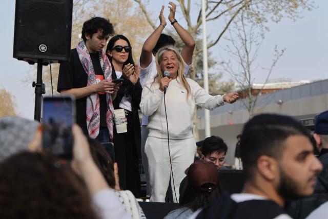 Mounia - the mother of the late Nahel a 17-year-old who was shot in the chest by police at point-blank range in 2023 - delivers remarks a march in support of Nahel and against Police impunity following the court's reclassification of the charges, in Nanterre, suburb of Paris on March 21, 2026. The Versailles Court of Appeal on March 5, 2026 has ordered a trial for assault resulting in death without intent against the Police officer who killed Nahel Merzouk, who was initially charged with murder. Nahel Merzouk, aged 17, was killed on June 27, 2023 by a bullet fired at point-blank range by a Police officer who was stopping the vehicle he was driving. (Photo by Ludovic MARIN / AFP)