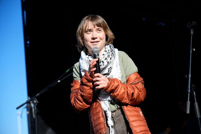 Swedish activist Greta Thunberg speaks during a Climate March at Christiansborg Slotsplads, in front of the Danish Parliament in Copenhagen, Denmark, on March 21, 2026. (Photo by Martin Sylvest / Ritzau Scanpix / AFP) / Denmark OUT