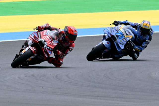 Ducati Lenovo's Spanish rider Marc Marquez (L) and BK8 Gresini Racing MotoGP's Spanish rider Alex Marquez race during the MotoGP qualifying session of the Grand Prix of Brazil, at the Ayrton Senna International racetrack in Goiania, state of Goias, Brazil, on March 21, 2026. (Photo by EVARISTO SA / AFP)