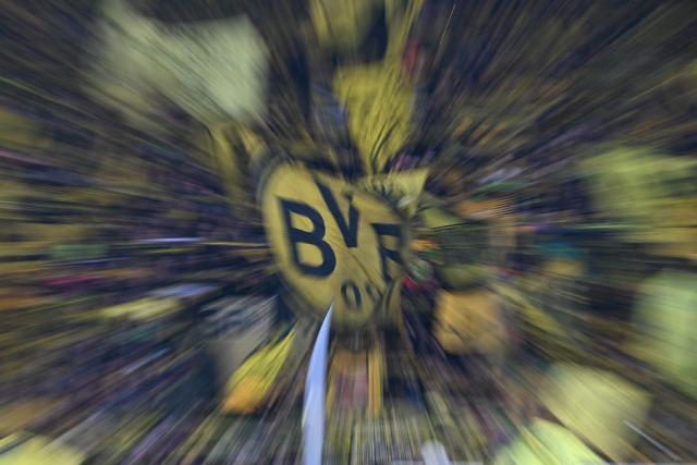Dortmund fans cheer prior to the German first division Bundesliga football match between Borussia Dortmund and HSV Hamburg in Dortmund, western Germany, on March 21, 2026. (Photo by UWE KRAFT / AFP) / DFL REGULATIONS PROHIBIT ANY USE OF PHOTOGRAPHS AS IMAGE SEQUENCES AND/OR QUASI-VIDEO