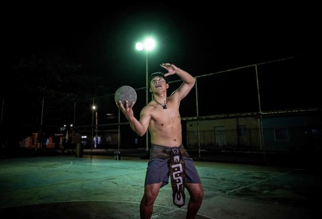 Angel Jesus Be Chi, captain of the Mexican Mayan ballgame team Mayawayak, holds a traditional ball during a practice session in San Pedro Chimay, Yucatan state, Mexico, on March 20, 2026. The Mayan ballgame dates back 3,500 years, making it the first organized sport in history. It is played with a heavy 3-kilogram solid rubber ball that is struck with the hips. The traditional game is still played in tournaments in seven countries: Mexico, the United States, Guatemala, Belize, Honduras, El Salvador and Panama. (Photo by Carl de Souza / AFP)
