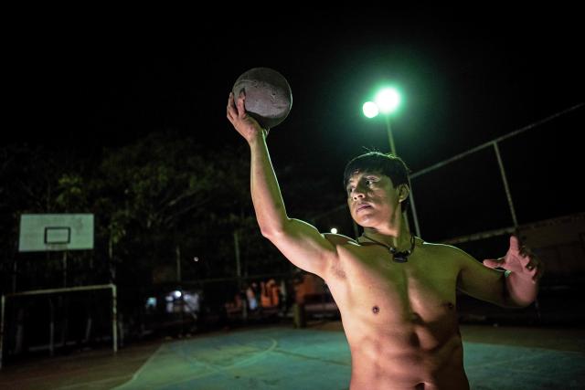 Angel Jesus Be Chi, captain of the Mexican Mayan ballgame team Mayawayak, holds a traditional ball during a practice session in San Pedro Chimay, Yucatan state, Mexico, on March 20, 2026. The Mayan ballgame dates back 3,500 years, making it the first organized sport in history. It is played with a heavy 3-kilogram solid rubber ball that is struck with the hips. The traditional game is still played in tournaments in seven countries: Mexico, the United States, Guatemala, Belize, Honduras, El Salvador and Panama. (Photo by Carl de Souza / AFP)