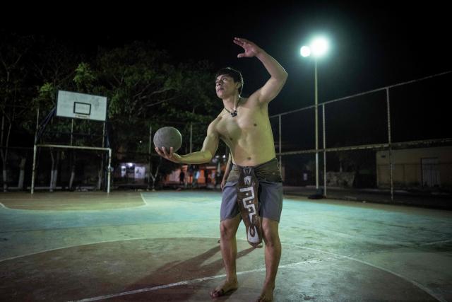 Angel Jesus Be Chi, captain of the Mexican Mayan ballgame team Mayawayak, holds a traditional ball during a practice session in San Pedro Chimay, Yucatan state, Mexico, on March 20, 2026. The Mayan ballgame dates back 3,500 years, making it the first organized sport in history. It is played with a heavy 3-kilogram solid rubber ball that is struck with the hips. The traditional game is still played in tournaments in seven countries: Mexico, the United States, Guatemala, Belize, Honduras, El Salvador and Panama. (Photo by Carl de Souza / AFP)