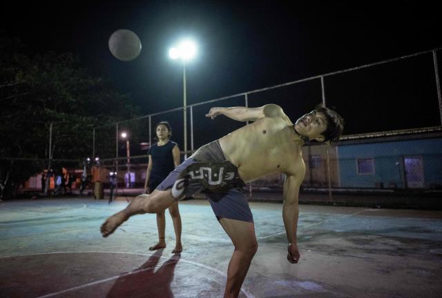 Angel Jesus Be Chi, captain of the Mexican Mayan ballgame team Mayawayak, plays with a traditional ball during a practice session in San Pedro Chimay, Yucatan state, Mexico, on March 20, 2026. The Mayan ballgame dates back 3,500 years, making it the first organized sport in history. It is played with a heavy 3-kilogram solid rubber ball that is struck with the hips. The traditional game is still played in tournaments in seven countries: Mexico, the United States, Guatemala, Belize, Honduras, El Salvador and Panama. (Photo by Carl de Souza / AFP)