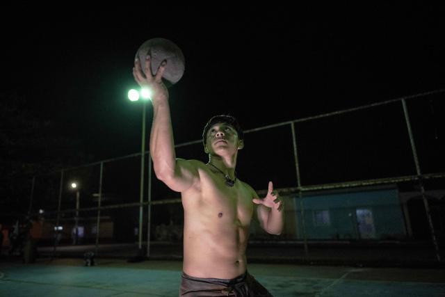 Angel Jesus Be Chi, captain of the Mexican Mayan ballgame team Mayawayak, holds a traditional ball during a practice session in San Pedro Chimay, Yucatan state, Mexico, on March 20, 2026. The Mayan ballgame dates back 3,500 years, making it the first organized sport in history. It is played with a heavy 3-kilogram solid rubber ball that is struck with the hips. The traditional game is still played in tournaments in seven countries: Mexico, the United States, Guatemala, Belize, Honduras, El Salvador and Panama. (Photo by Carl de Souza / AFP)