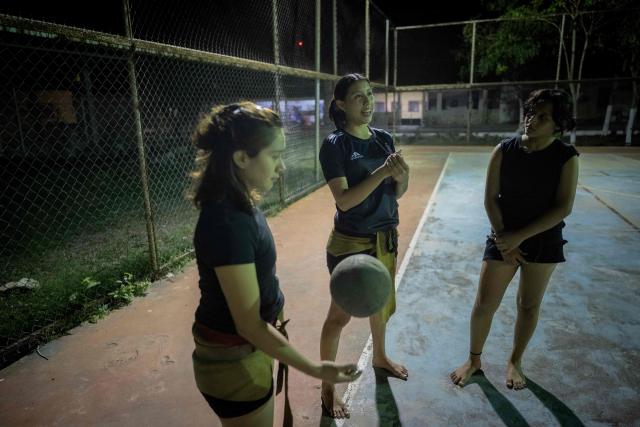 Young women from the Mexican Mayan ballgame team Mayawayak take part in a practice session in San Pedro Chimay, Yucatan state, Mexico, on March 20, 2026. The Mayan ballgame dates back 3,500 years, making it the first organized sport in history. It is played with a heavy 3-kilogram solid rubber ball that is struck with the hips. The traditional game is still played in tournaments in seven countries: Mexico, the United States, Guatemala, Belize, Honduras, El Salvador and Panama. (Photo by Carl de Souza / AFP)