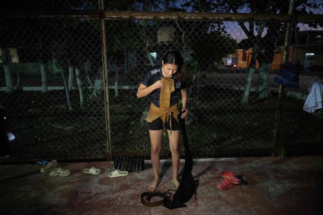 A young woman from the Mexican Mayan ballgame team Mayawayak takes part in a practice session in San Pedro Chimay, Yucatan state, Mexico, on March 20, 2026. The Mayan ballgame dates back 3,500 years, making it the first organized sport in history. It is played with a heavy 3-kilogram solid rubber ball that is struck with the hips. The traditional game is still played in tournaments in seven countries: Mexico, the United States, Guatemala, Belize, Honduras, El Salvador and Panama. (Photo by Carl de Souza / AFP)