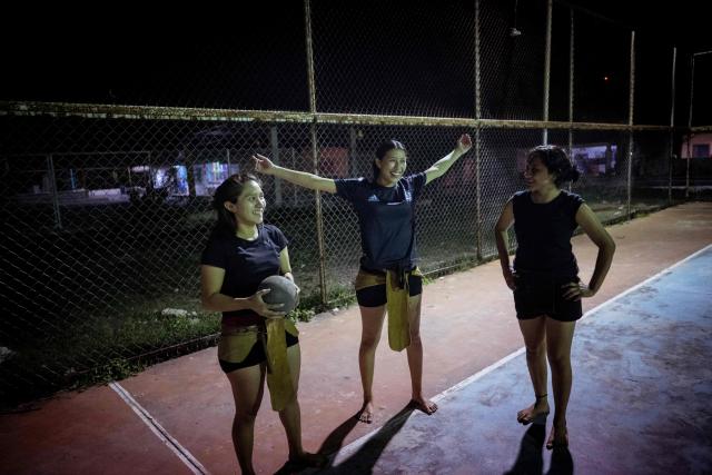 Young women from the Mexican Mayan ballgame team Mayawayak take part in a practice session in San Pedro Chimay, Yucatan state, Mexico, on March 20, 2026. The Mayan ballgame dates back 3,500 years, making it the first organized sport in history. It is played with a heavy 3-kilogram solid rubber ball that is struck with the hips. The traditional game is still played in tournaments in seven countries: Mexico, the United States, Guatemala, Belize, Honduras, El Salvador and Panama. (Photo by Carl de Souza / AFP)