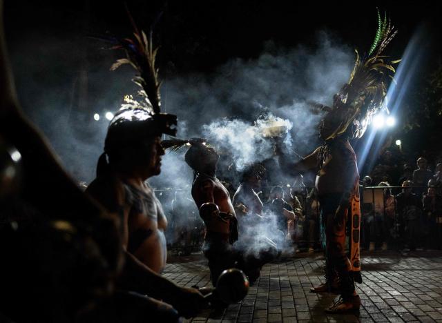 Players prepare with a ritual ceremony for a Mayan ballgame show in Merida, Yucatan state, Mexico, on March 20, 2026. The Mayan ballgame dates back 3,500 years, making it the first organized sport in history. It is played with a heavy 3-kilogram solid rubber ball that is struck with the hips. The traditional game is still played in tournaments in seven countries: Mexico, the United States, Guatemala, Belize, Honduras, El Salvador and Panama. (Photo by Carl de Souza / AFP)