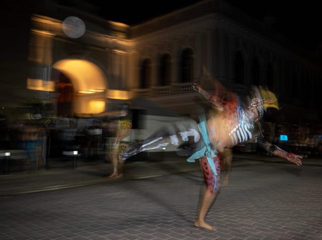 Players participate in a Mayan ballgame show in Merida, Yucatan state, Mexico, on March 20, 2026. The Mayan ballgame dates back 3,500 years, making it the first organized sport in history. It is played with a heavy 3-kilogram solid rubber ball that is struck with the hips. The traditional game is still played in tournaments in seven countries: Mexico, the United States, Guatemala, Belize, Honduras, El Salvador and Panama. (Photo by Carl de Souza / AFP)