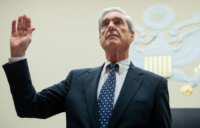 (FILES) Former Special Counsel Robert Mueller is sworn in for his testimony before the House Select Committee on Intelligence hearing on Capitol Hill in Washington, DC, July 24, 2019. Mueller, the former FBI director who led a politically explosive investigation into President Donald Trump, has died aged 81, US media reported on March 21, 2026. (Photo by SAUL LOEB / AFP)