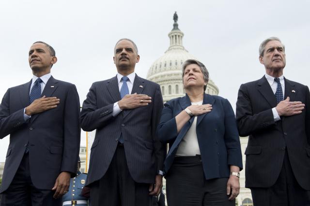 (FILES) L-R: US President Barack Obama (L), Attorney General Eric Holder, Secretary of Homeland Security Janet Napolitano and Director of the Federal Bureau Investigation (FBI) Robert Mueller stand during the National Anthem at the National Peace Officers Memorial Service, an annual ceremony honoring law enforcement who were killed in the line of duty in the previous year, at the US Capitol in Washington, DC, May 15, 2013. Mueller, the former FBI director who led a politically explosive investigation into President Donald Trump, has died aged 81, US media reported Saturday. (Photo by Saul LOEB / AFP)
