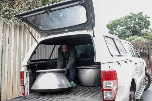 A volunteer from the Muslim Ziaee Institute South Africa (ZISA) prepares for a charity drive in the Fietas district in Johannesburg on the occasion of the Eid al-Fitr at the end of the Muslim fasting month of Ramadan, on March 21, 2026. (Photo by ILARIA FINIZIO / AFP)