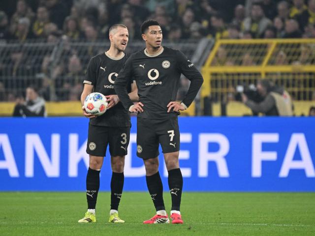 Dortmund's German defender #03 Waldemar Anton (L) and Dortmund's English midfielder #07 Jobe Bellingham react during the German first division Bundesliga football match between Borussia Dortmund and HSV Hamburg in Dortmund, western Germany, on March 21, 2026. (Photo by UWE KRAFT / AFP) / DFL REGULATIONS PROHIBIT ANY USE OF PHOTOGRAPHS AS IMAGE SEQUENCES AND/OR QUASI-VIDEO