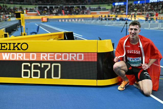 TOPSHOT - Switzerland's Simon Ehammer celebrates winning and setting a new world record after competing in the men's heptathlon 1000m final during the World Athletics Indoor Championships Kujawy Pomorze 2026 in Torun, Poland on March 21, 2026. (Photo by Andrej ISAKOVIC / AFP)