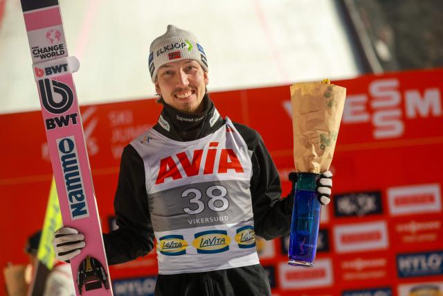 Third placed Norway's Johann Andre Forfang celebrates on the podium after the men's ski flying event of the FIS Ski Jumping World Cup in Vikersund, Norway on March 21, 2028. (Photo by Trond R Teigen / NTB / AFP) / Norway OUT