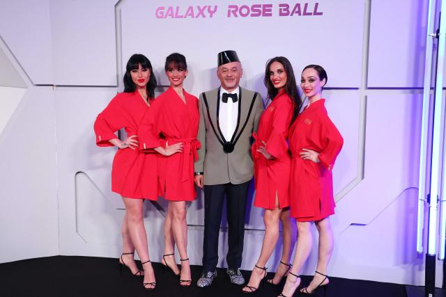 French fashion designer Christian Louboutin (C) poses upon arrival for the 70th edition of the "Bal de la Rose" (Rose Ball) event at the Monte-Carlo Sporting Club in Monaco, on March 21, 2026. Created by Princess Grace of Monaco in 1954, The Rose Ball is one of the major charity events in Monaco, and benefits the Princess Grace Foundation. (Photo by Valery HACHE / AFP) / ==== NO TABLOIDS WEB & PRINT, NO DAILY MAIL, NO DAILY MAIL GROUP, NO VOICI, NO CLOSER ====