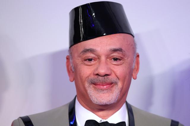 French fashion designer Christian Louboutin poses upon arrival for the 70th edition of the "Bal de la Rose" (Rose Ball) event at the Monte-Carlo Sporting Club in Monaco, on March 21, 2026. Created by Princess Grace of Monaco in 1954, The Rose Ball is one of the major charity events in Monaco, and benefits the Princess Grace Foundation. (Photo by Valery HACHE / AFP) / ==== NO TABLOIDS WEB & PRINT, NO DAILY MAIL, NO DAILY MAIL GROUP, NO VOICI, NO CLOSER ====