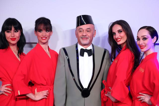 French fashion designer Christian Louboutin (C) poses upon arrival for the 70th edition of the "Bal de la Rose" (Rose Ball) event at the Monte-Carlo Sporting Club in Monaco, on March 21, 2026. Created by Princess Grace of Monaco in 1954, The Rose Ball is one of the major charity events in Monaco, and benefits the Princess Grace Foundation. (Photo by Valery HACHE / AFP) / ==== NO TABLOIDS WEB & PRINT, NO DAILY MAIL, NO DAILY MAIL GROUP, NO VOICI, NO CLOSER ====
