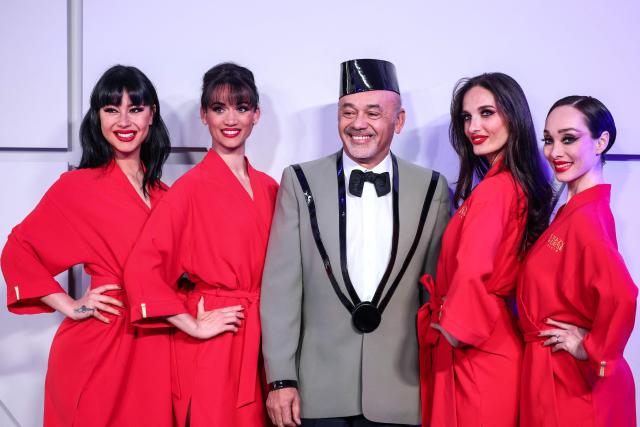 French fashion designer Christian Louboutin (C) poses upon arrival for the 70th edition of the "Bal de la Rose" (Rose Ball) event at the Monte-Carlo Sporting Club in Monaco, on March 21, 2026. Created by Princess Grace of Monaco in 1954, The Rose Ball is one of the major charity events in Monaco, and benefits the Princess Grace Foundation. (Photo by Valery HACHE / AFP) / ==== NO TABLOIDS WEB & PRINT, NO DAILY MAIL, NO DAILY MAIL GROUP, NO VOICI, NO CLOSER ====