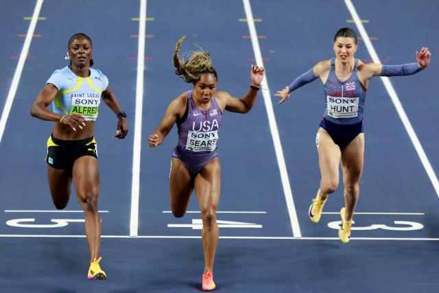 Saint Lucia's Julien Alfred (L), USA's Jacious Sears and Britain's Amy Hunt compete in the women's 60m semi-final heat 1 during the World Athletics Indoor Championships Kujawy Pomorze 2026 in Torun, Poland on March 21, 2026. (Photo by Wojtek RADWANSKI / AFP)