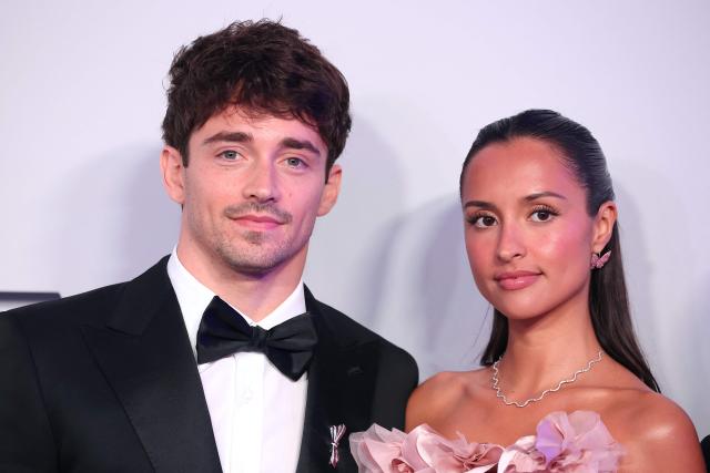 Monegasque Formula One pilot Charles Leclerc (L) and his wife Alexandra pose upon arrival for the 70th edition of the "Bal de la Rose" (Rose Ball) event at the Monte-Carlo Sporting Club in Monaco, on March 21, 2026. Created by Princess Grace of Monaco in 1954, The Rose Ball is one of the major charity events in Monaco, and benefits the Princess Grace Foundation. (Photo by Valery HACHE / AFP) / ==== NO TABLOIDS WEB & PRINT, NO DAILY MAIL, NO DAILY MAIL GROUP, NO VOICI, NO CLOSER ====