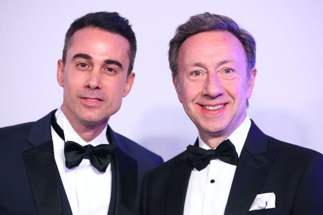 French-Luxembourgish journalist and TV and radio host Stephane Bern (R) and his companion Yori Bailleres (L) pose upon arrival for the 70th edition of the "Bal de la Rose" (Rose Ball) event at the Monte-Carlo Sporting Club in Monaco, on March 21, 2026. Created by Princess Grace of Monaco in 1954, The Rose Ball is one of the major charity events in Monaco, and benefits the Princess Grace Foundation. (Photo by Valery HACHE / AFP) / ==== NO TABLOIDS WEB & PRINT, NO DAILY MAIL, NO DAILY MAIL GROUP, NO VOICI, NO CLOSER ====
