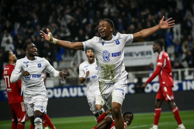 Auxerre’s French Swiss defender #24 Bryan Okoh (C) celebrates after scoring a goal during the French ligue 1 football match between Auxerre (AJ Auxerre) and Brest (Stade Brestois) at Abbe Deschamps stadium in Auxerre, central eastern France on March 21, 2026. (Photo by ARNAUD FINISTRE / AFP)
