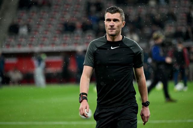 French referee Willy Delajod warms up prior to the French L1 football match between OGC Nice and Paris Saint-Germain at the Allianz Riviera stadium in Nice, southern France, on March 21, 2026. (Photo by Miguel MEDINA / AFP)