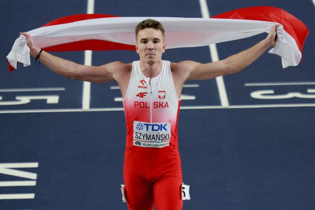 Poland's Jakub Szymanski celebrates after winning the men's 60m hurdles final during the World Athletics Indoor Championships Kujawy Pomorze 2026 in Torun, Poland on March 21, 2026. (Photo by Wojtek RADWANSKI / AFP)