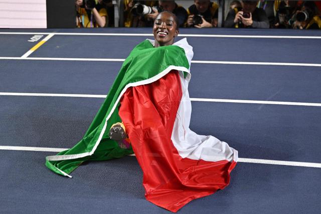 Italy's Zaynab Dosso celebrates winning the women's 60m final during the World Athletics Indoor Championships Kujawy Pomorze 2026 in Torun, Poland on March 21, 2026. (Photo by Andrej ISAKOVIC / AFP)