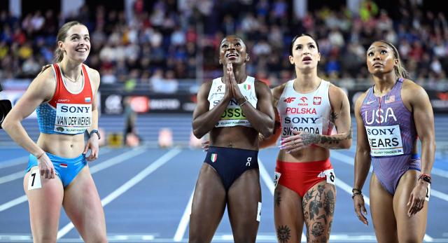 (LtoR) Luxembourg's Patrizia Van Der Weken, winner Italy's Zaynab Dosso, Poland's Ewa Swoboda and second placed USA's Jacious Sears react after the women's 60m final during the World Athletics Indoor Championships Kujawy Pomorze 2026 in Torun, Poland on March 21, 2026. (Photo by Kirill KUDRYAVTSEV / AFP)