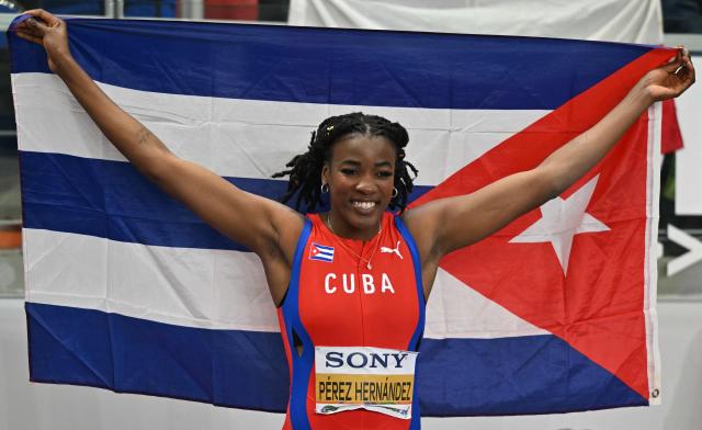 First placed Cuba's Leyanis Perez Hernandez celebrates after winning in the women's triple jump final during the World Athletics Indoor Championships Kujawy Pomorze 2026 in Torun, Poland on March 21, 2026. (Photo by Andrej ISAKOVIC / AFP)