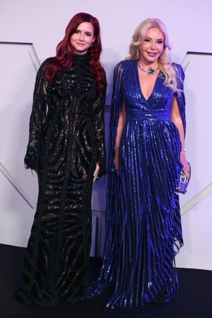 Italian businesswoman, film producer Lady Monika Bacardi (R) and her daughter Maria Luisa pose upon arrival for the 70th edition of the "Bal de la Rose" (Rose Ball) event at the Monte-Carlo Sporting Club in Monaco, on March 21, 2026. Created by Princess Grace of Monaco in 1954, The Rose Ball is one of the major charity events in Monaco, and benefits the Princess Grace Foundation. (Photo by Valery HACHE / AFP) / ==== NO TABLOIDS WEB & PRINT, NO DAILY MAIL, NO DAILY MAIL GROUP, NO VOICI, NO CLOSER ====