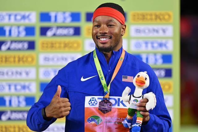 Bronze medallist USA's Kyle Garland celebrates on the podium for the men's heptathlon during the World Athletics Indoor Championships Kujawy Pomorze 2026 in Torun, Poland on March 21, 2026. (Photo by Andrej ISAKOVIC / AFP)