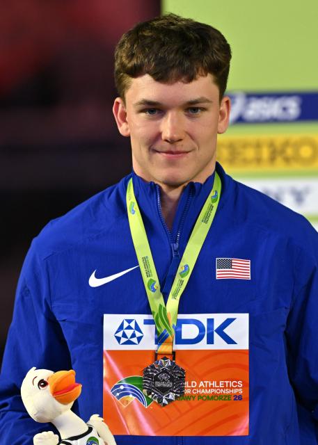 Silver medallist USA's Heath Baldwin celebrates on the podium for the men's heptathlon during the World Athletics Indoor Championships Kujawy Pomorze 2026 in Torun, Poland on March 21, 2026. (Photo by Andrej ISAKOVIC / AFP)