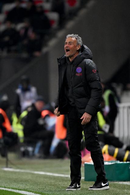 Paris Saint-Germain's Spanish headcoach Luis Enrique reacts during during the French L1 football match between OGC Nice and Paris Saint-Germain at the Allianz Riviera stadium in Nice, southern France, on March 21, 2026. (Photo by Miguel MEDINA / AFP)