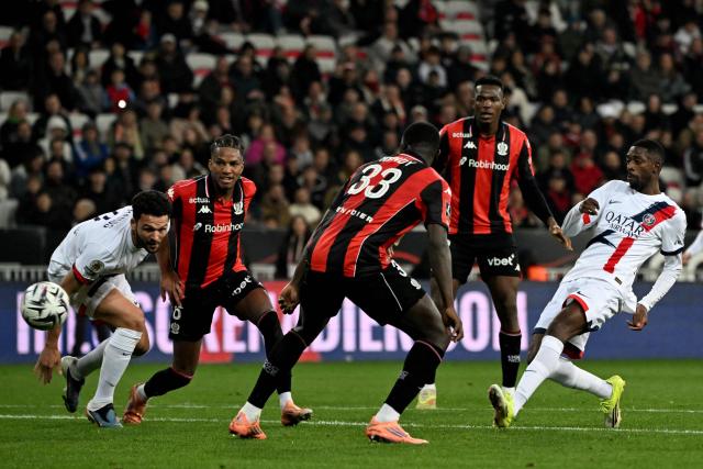 Paris Saint-Germain's French forward #10 Ousmane Dembele (R) takes a shot during the French L1 football match between OGC Nice and Paris Saint-Germain at the Allianz Riviera stadium in Nice, southern France, on March 21, 2026. (Photo by Miguel MEDINA / AFP)