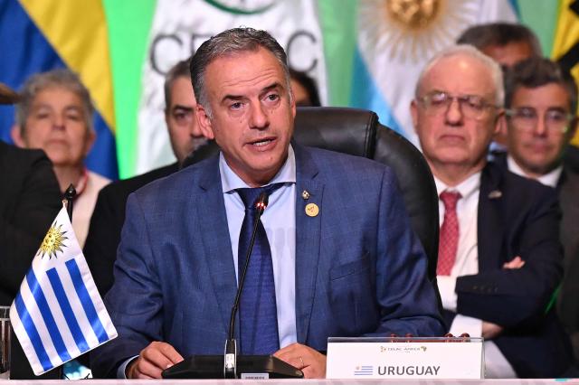 Uruguay's President Yamandu Orsi speaks after receiving the pro tempore presidency from Colombia's President Gustavo Petro (out of frame) during the X Summit of Heads of State and Government, within the framework of the CELAC-Africa High-Level Forum, in Bogota on March 21, 2026. (Photo by Raul ARBOLEDA / AFP)