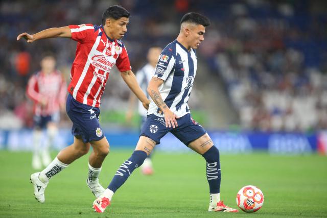 Guadalajara's forward #20 Angel Sepulveda and Monterrey's defender #21 Luis Reyes fight for the ball during the Liga MX Clausura football match between Monterrey and Guadalajara at the BBVA Stadium in Monterrey, Mexico, on March 21, 2026. (Photo by Julio Cesar AGUILAR / AFP)