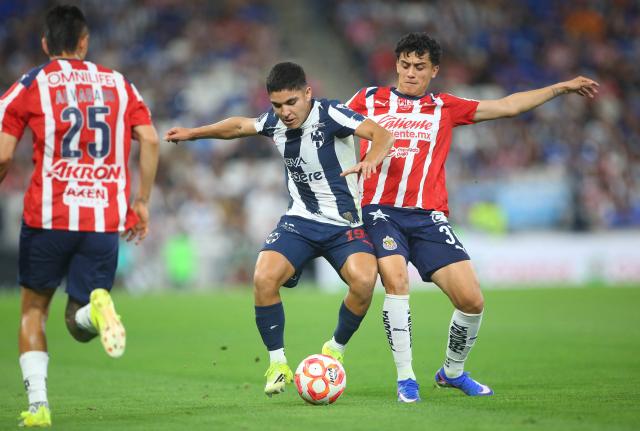 Monterrey's defender #194 Christian Reyes and Guadalajara's US defender #37 Richard Ledezma fight for the ball during the Liga MX Clausura football match between Monterrey and Guadalajara at the BBVA Stadium in Monterrey, Mexico, on March 21, 2026. (Photo by Julio Cesar AGUILAR / AFP)