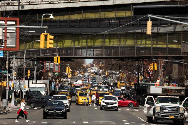 Pedestrians and cars move along Ninth Avenue in the Manhattan borough of New York City on March 21, 2026 (Photo by CHARLY TRIBALLEAU / AFP)