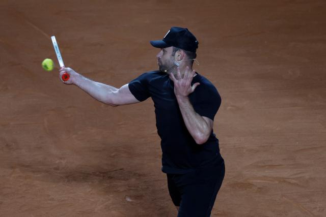 US former player Andrew Roddick returns during an exhibition match against Argentina's former tennis players Diego Schwartzman (L) and Juan Martin Del Potro ahead of the Latin America Open Tournament in Sao Paulo, Brazil on March 21, 2026. (Photo by Miguel SCHINCARIOL / AFP)