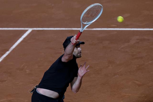 US former player Andrew Roddick returns during an exhibition match against Argentina's former tennis players Diego Schwartzman (L) and Juan Martin Del Potro ahead of the Latin America Open Tournament in Sao Paulo, Brazil on March 21, 2026. (Photo by Miguel SCHINCARIOL / AFP)