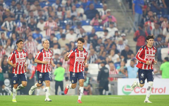 Guadalajara's defender #21 Jose Castillo (C) celebrates after scoring his team's second goal during the Liga MX Clausura football match between Monterrey and Guadalajara at the BBVA Stadium in Monterrey, Mexico, on March 21, 2026. (Photo by Julio Cesar AGUILAR / AFP)