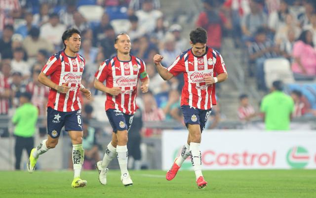 Guadalajara's defender #21 Jose Castillo (R) celebrates after scoring his team's second goal during the Liga MX Clausura football match between Monterrey and Guadalajara at the BBVA Stadium in Monterrey, Mexico, on March 21, 2026. (Photo by Julio Cesar AGUILAR / AFP)
