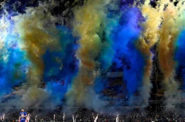 Pumas' Spanish defender #05 Ruben Duarte stands on the pitch in front of smoke with his club's colors before the Liga MX Clausura match between Pumas and America at Olimpico Universitario Stadium in Mexico City on March 21, 2026. (Photo by Alfredo ESTRELLA / AFP)