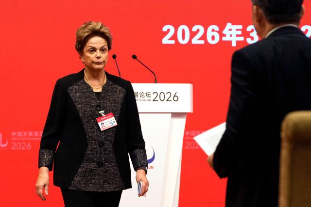 Dilma Rousseff, former Brazil president and current president of the New Development Bank, leaves after speaking at the China Development Forum 2026 held at the Diaoyutai State Guesthouse in Beijing on March 22, 2026. (Photo by Ng Han Guan / POOL / AFP)