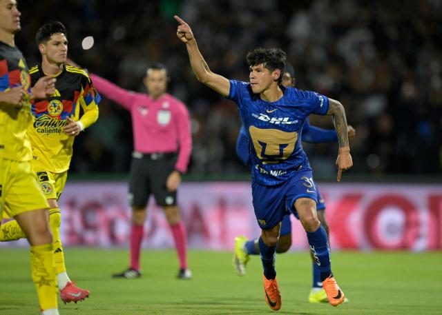 Pumas' Paraguayan forward #31 Robert Morales celebrates after scoring a late goal from the penalty spot to win during the Liga MX Clausura match between Pumas and America at Olimpico Universitario Stadium in Mexico City on March 21, 2026. (Photo by Alfredo ESTRELLA / AFP)